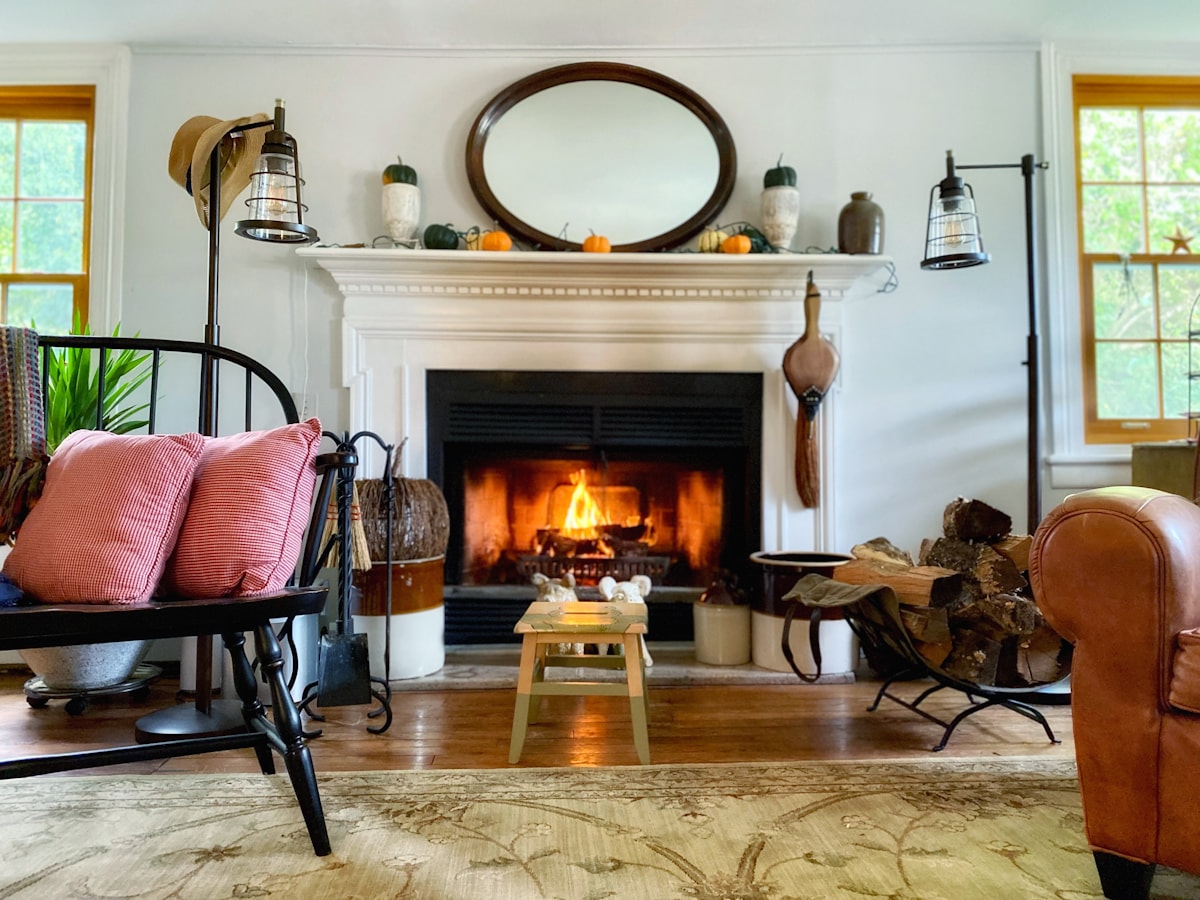 Traditional mantel fireplace in a warm living room