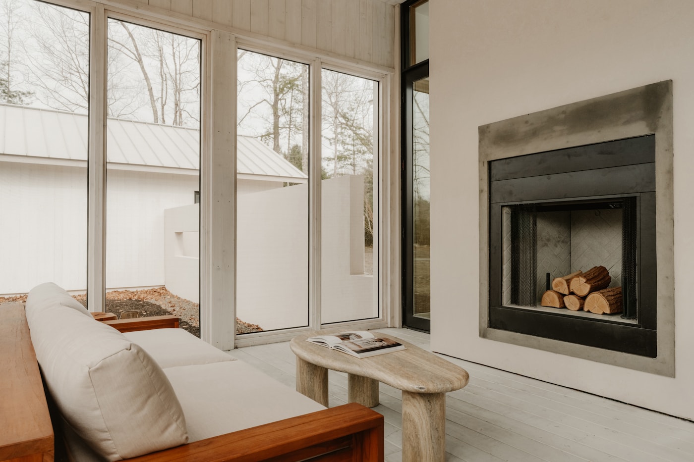 Contemporary built-in fireplace in a bright living room